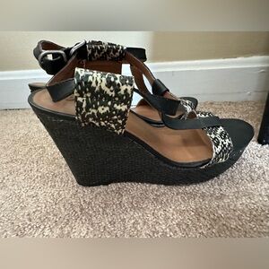 Black and snakeskin wedge heels